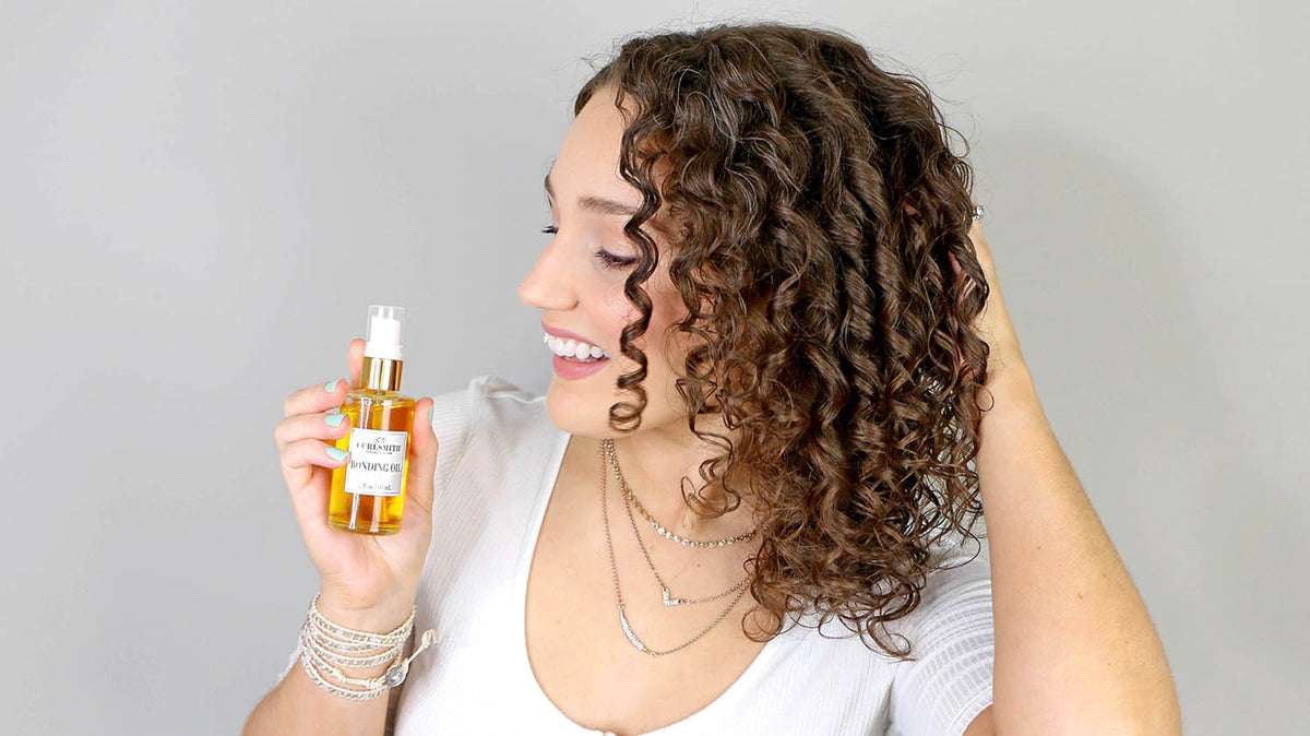 a woman holding a bottle of hair