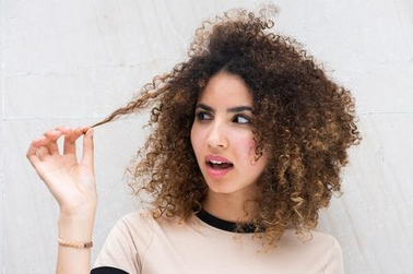 a woman holding her hair