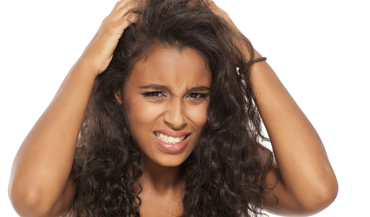 a woman with her hands on her head
