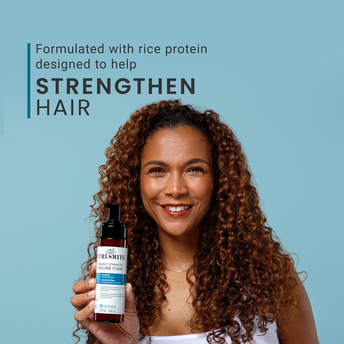 Woman holding a bottle of hair care product with text about rice protein and hair strength on a blue background