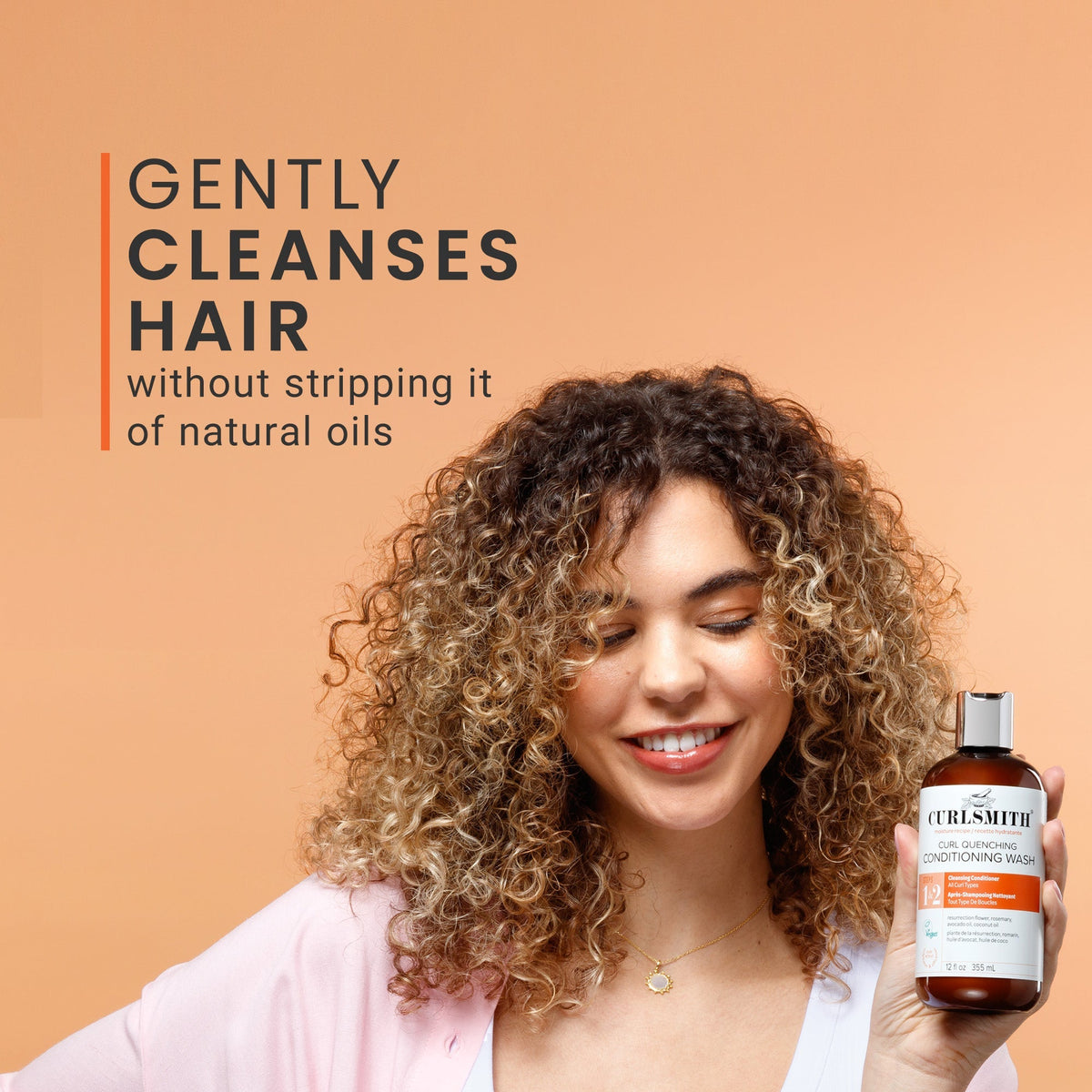 Woman holding a bottle of Curlsmith hair care product with text on a beige background