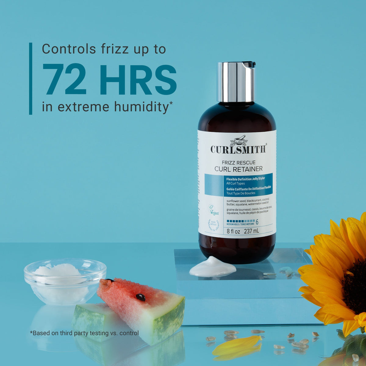 Curlsmith hair product bottle with text on a blue background, featuring a sunflower and watermelon.