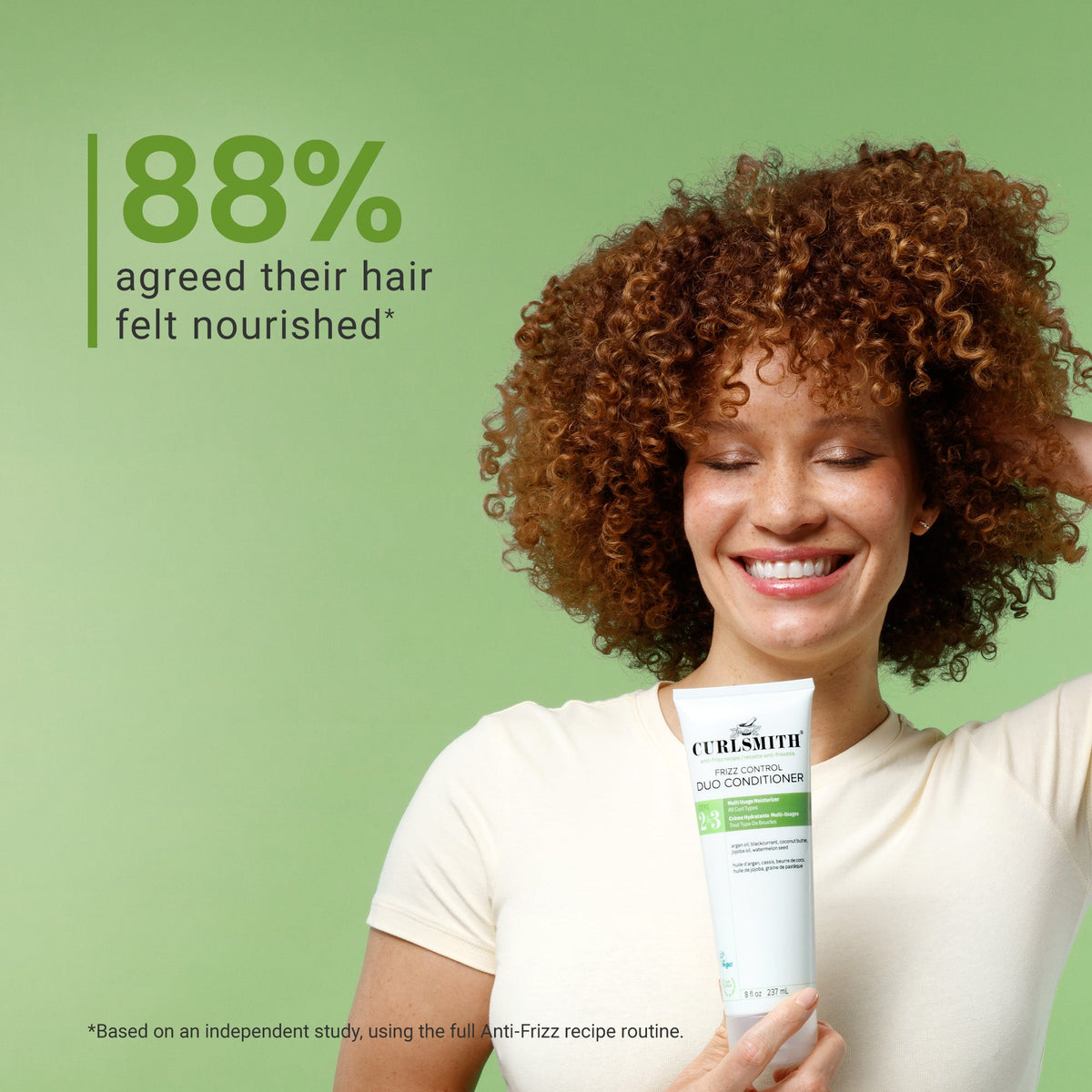 Woman holding a Curly Smith product with a green background and text about hair nourishment.