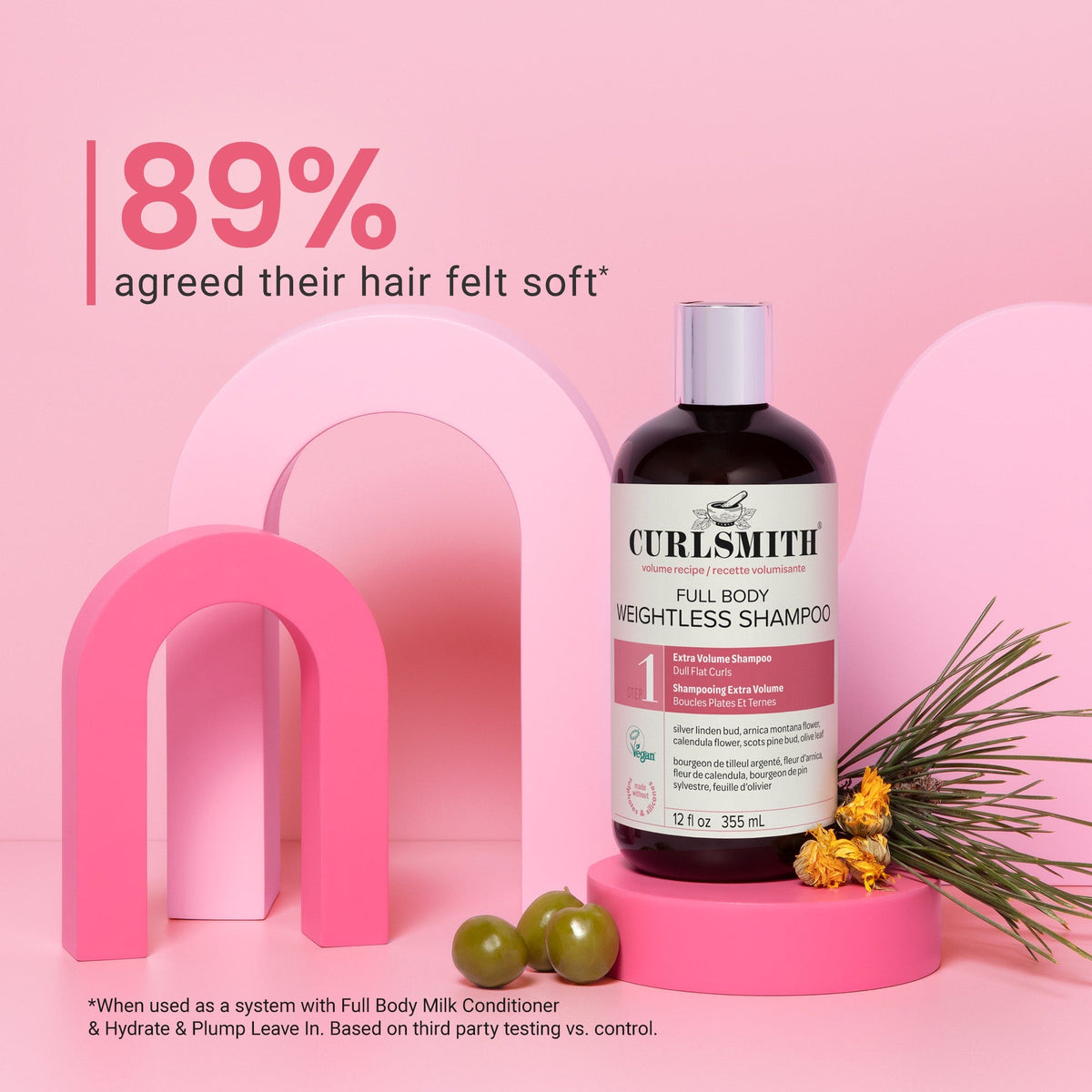 Curlsmith shampoo bottle on a pink background with text about hair softness.