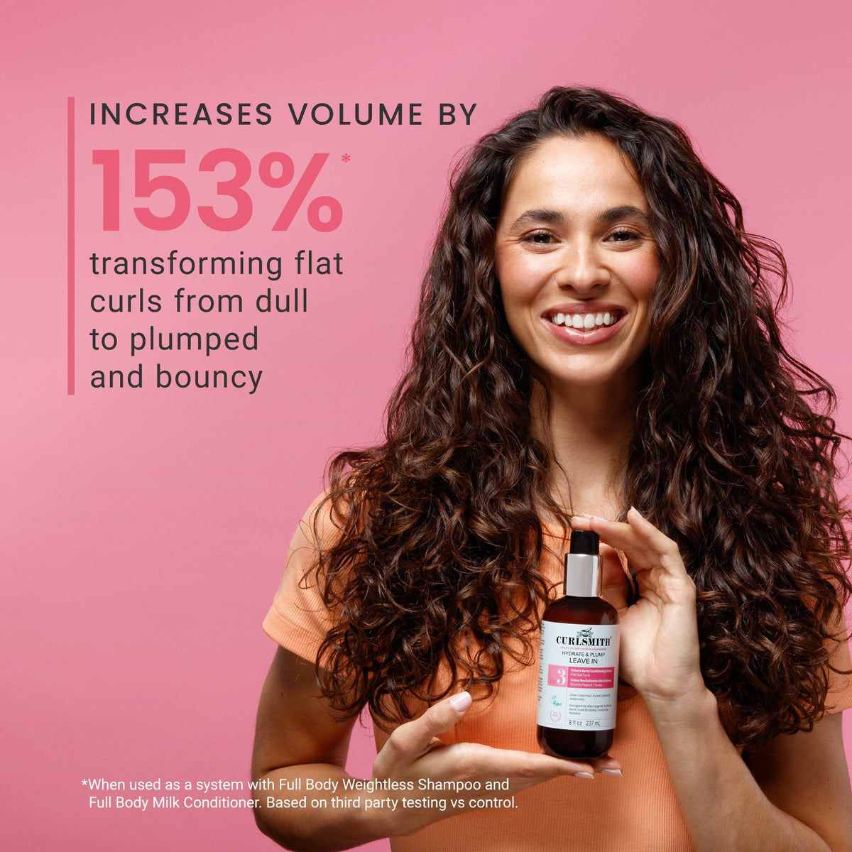 Woman holding a bottle of Curlesuite hair product with text on a pink background