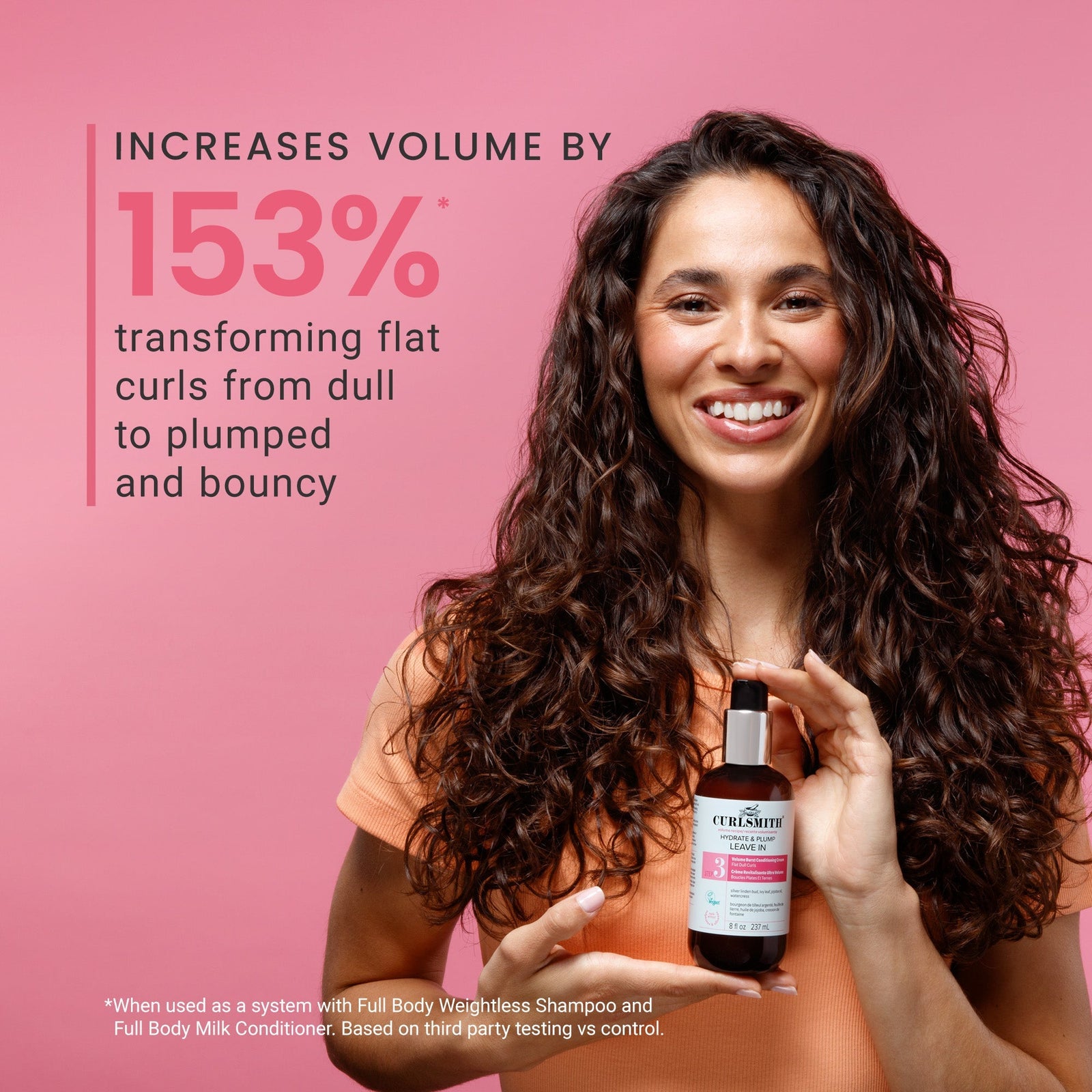 Woman holding a bottle of Curlesuite hair product with text on a pink background