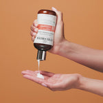 Hand holding Curl Quenching Conditioning Wash