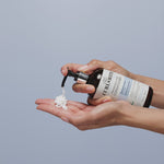 Person applying Curlsmith Fragrance-Free Conditioner